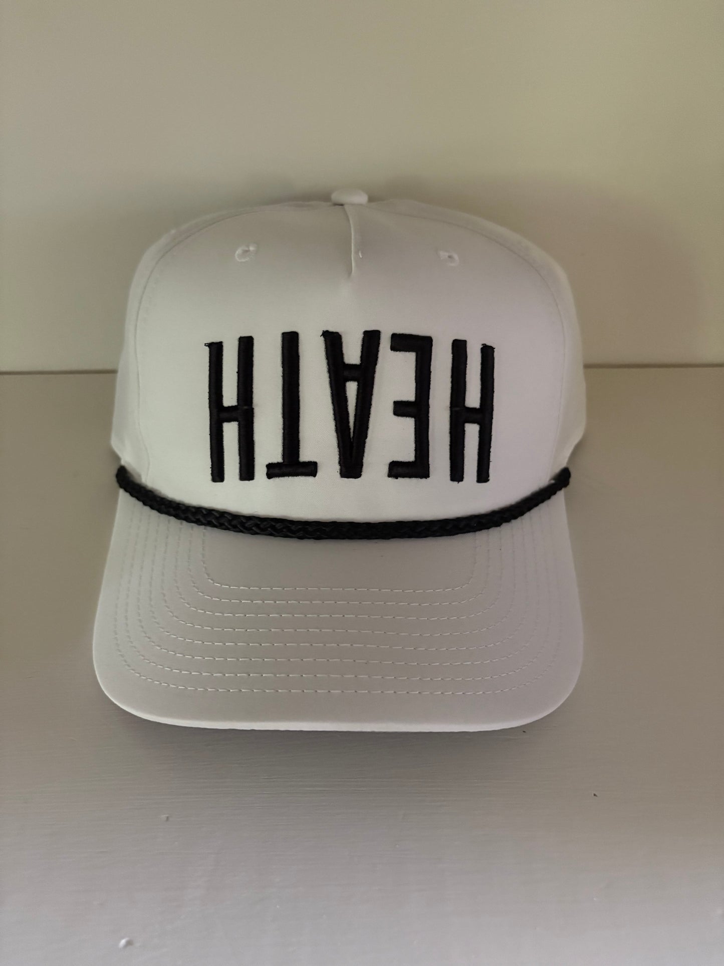 White cap w/ Black rope and upside down "HEATH" - Multiple Colors Available